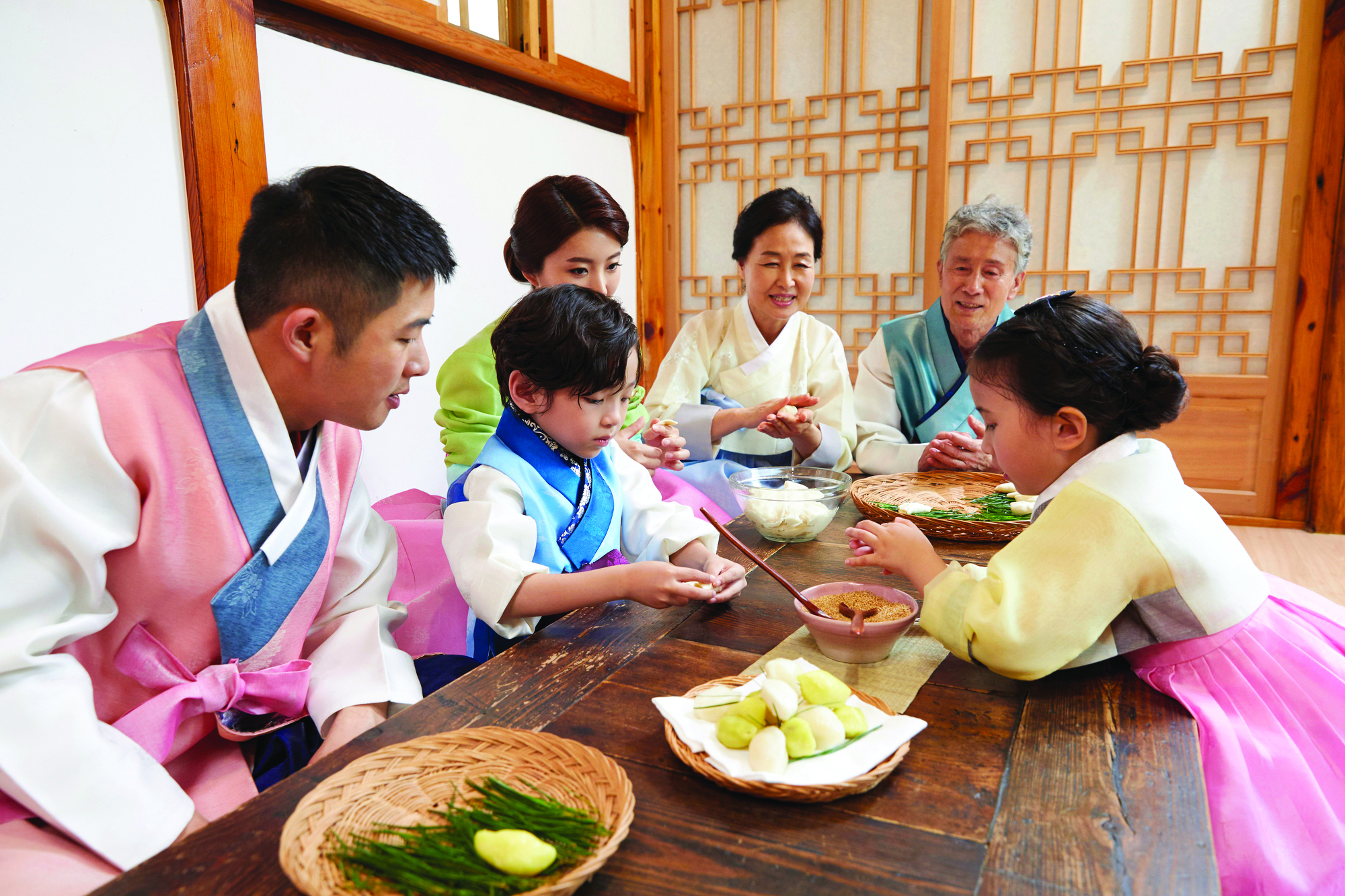 Chuseok and Songpyeon-Family members gather together and make songpyeon (half-moon shape rice cake), one of representative Chuseok delicacies.